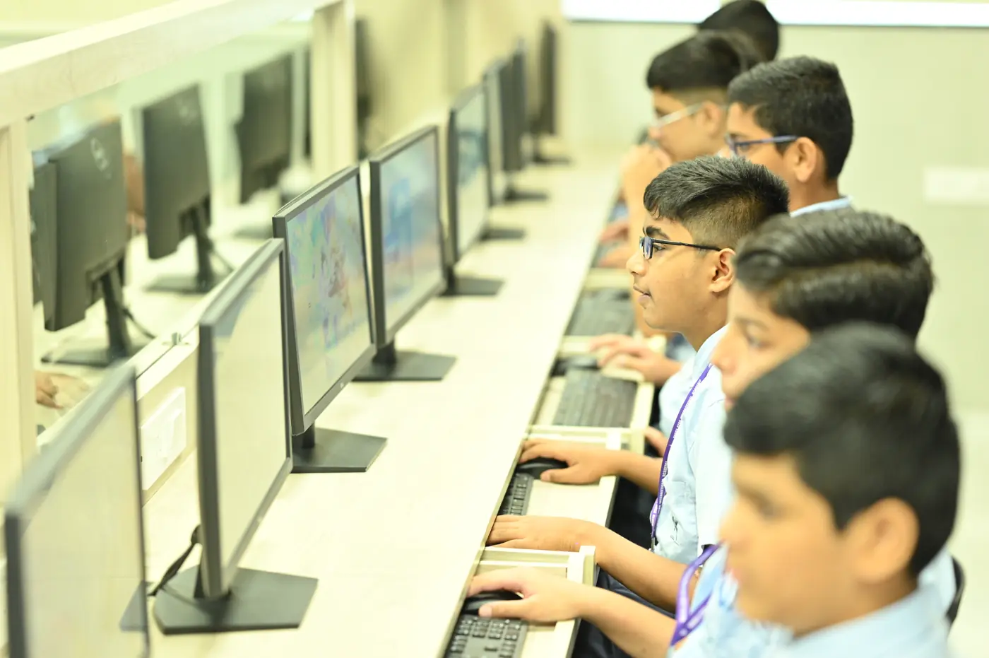 Students working at computers in the ICT lab