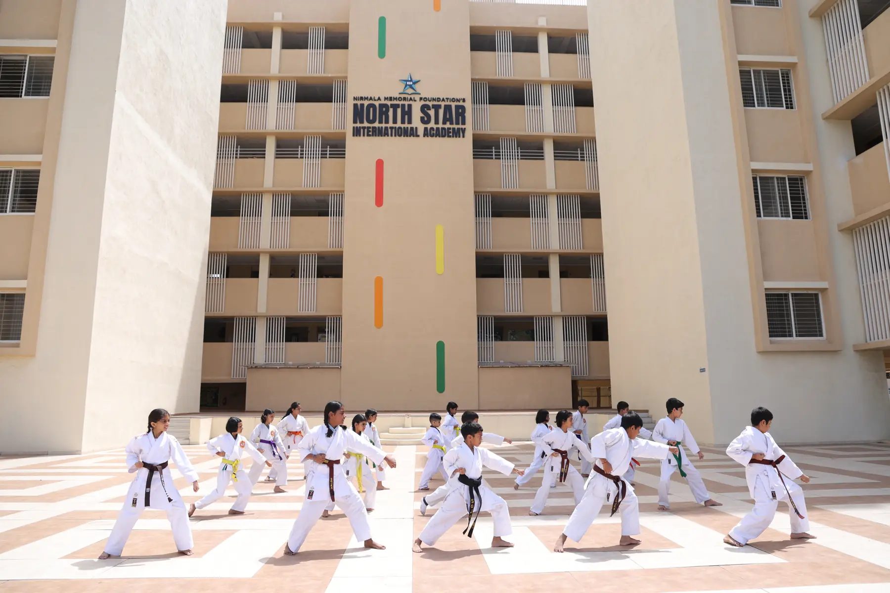 Students practising karate in the North Star campus courtyard